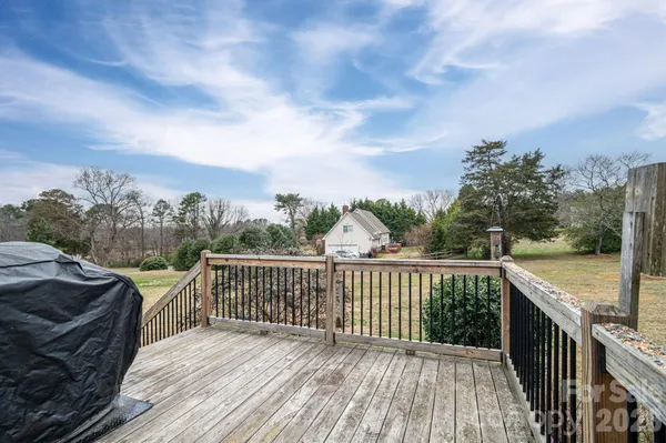 a view of a brick house with large windows