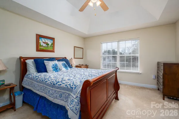 a bed room with a bed and a television