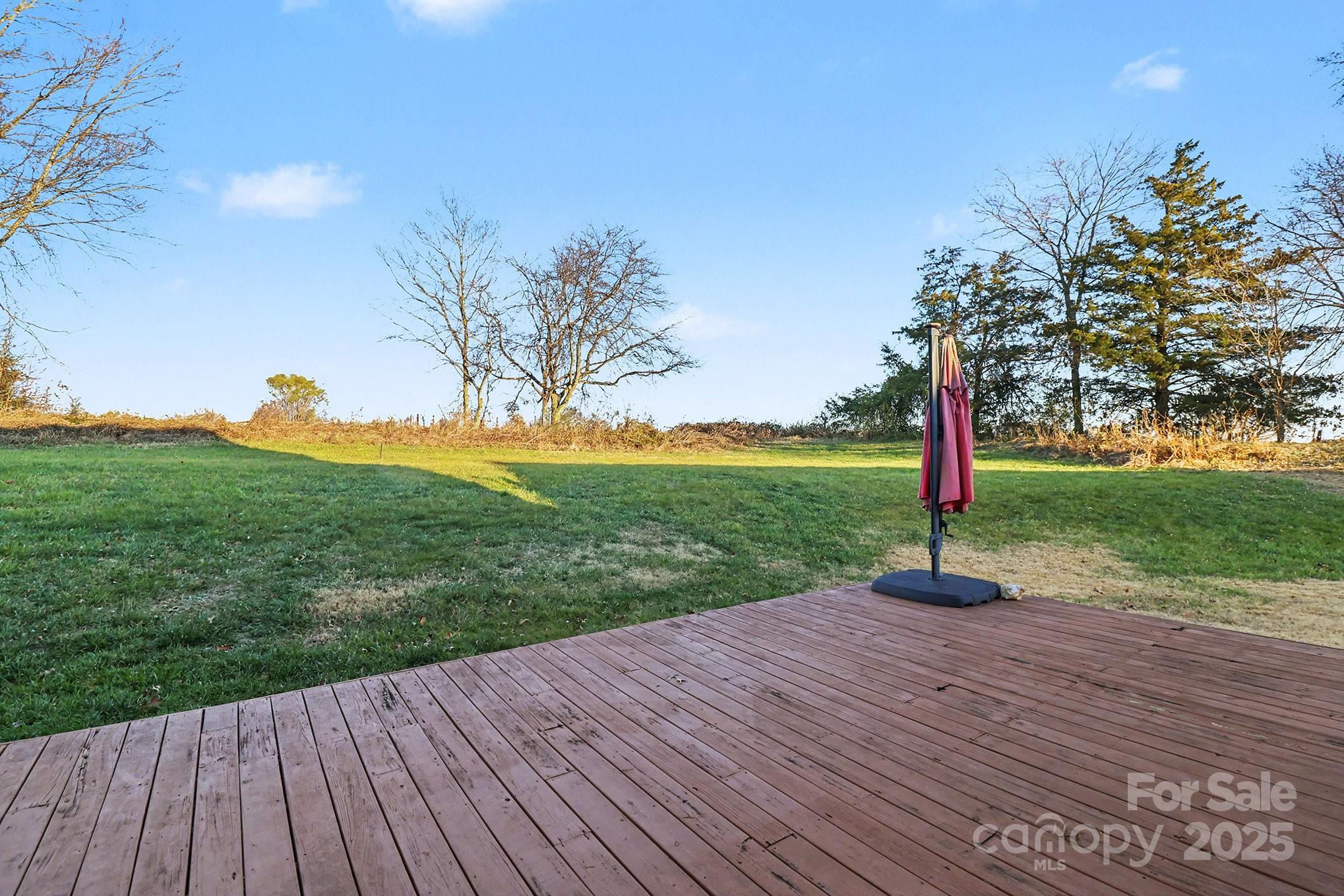 5307 Bendix Court Harrisburg, NC 28075 - Photo 21 of 25 a view of a deck with a yard