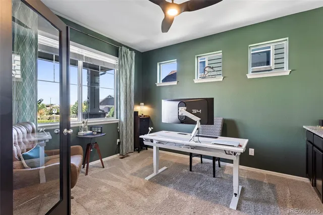 a workspace with furniture and a window