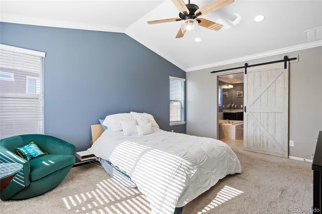 a bedroom with a bed dresser and a window