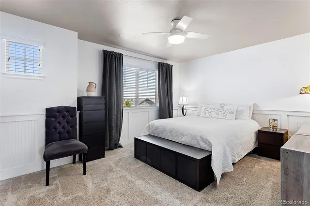 a bedroom with bed and window