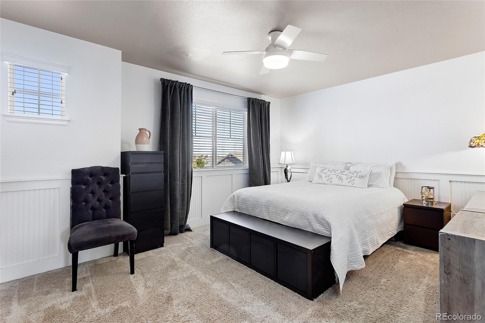 1444 Sidewinder Circle Castle Rock, CO 80108 - Photo 18 of 40 a bedroom with bed and window