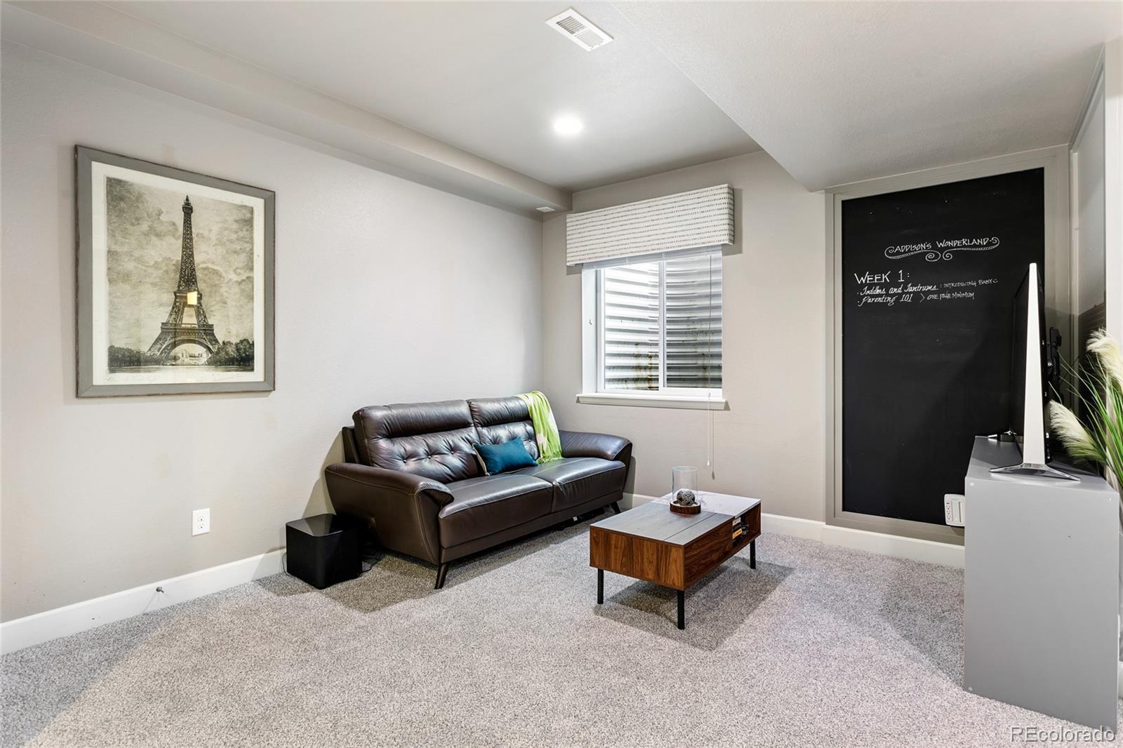 1444 Sidewinder Circle Castle Rock, CO 80108 - Photo 22 of 40 a living room with furniture and a window