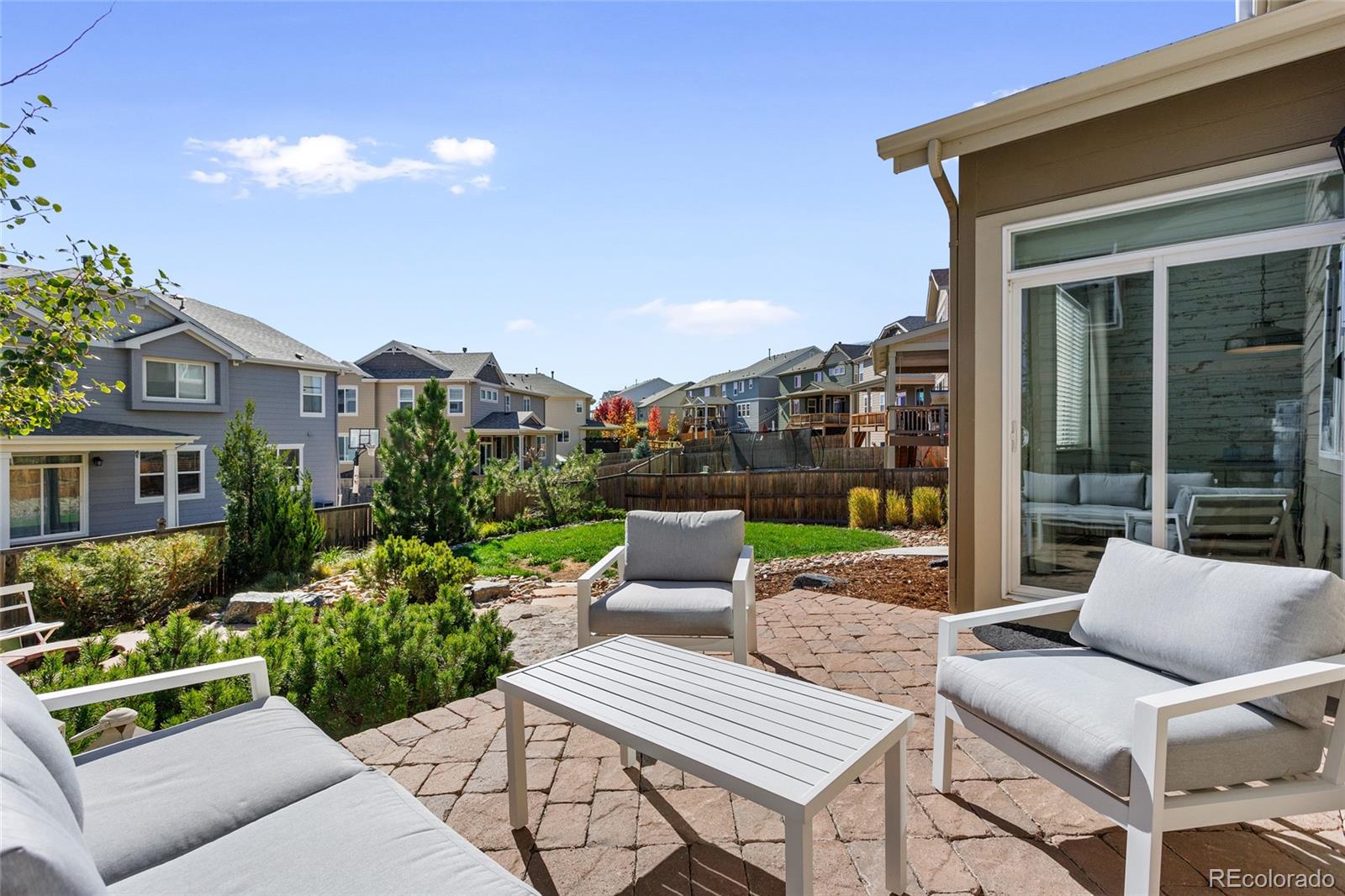 1444 Sidewinder Circle Castle Rock, CO 80108 - Photo 28 of 40 a view of a patio with couches table and chairs and potted plants