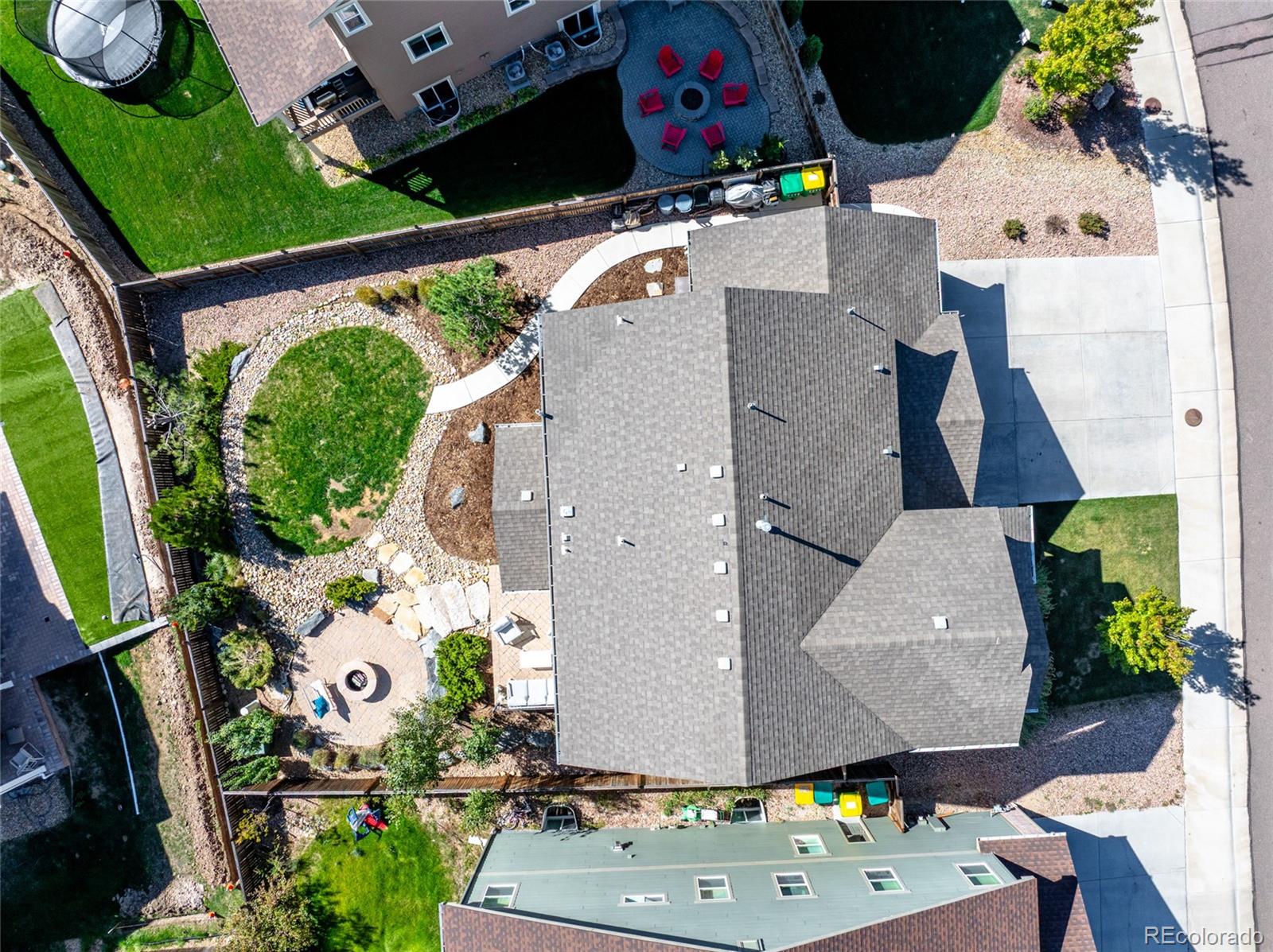 1444 Sidewinder Circle Castle Rock, CO 80108 - Photo 32 of 40 an aerial view of a house with a yard and a fountain