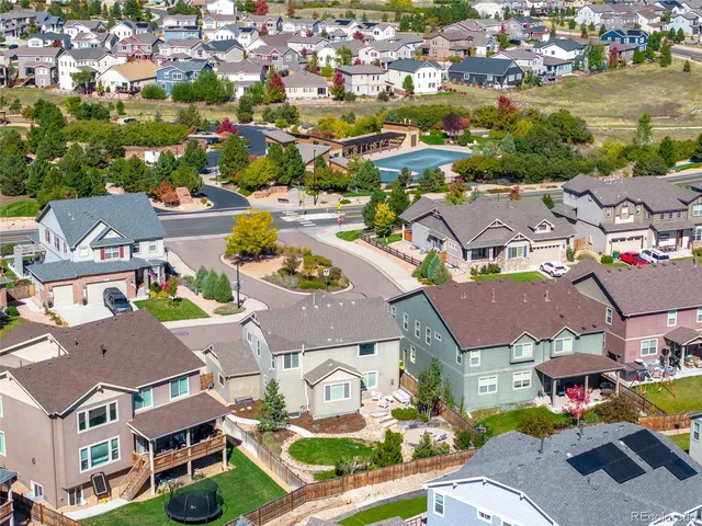 an aerial view of residential houses with outdoor space