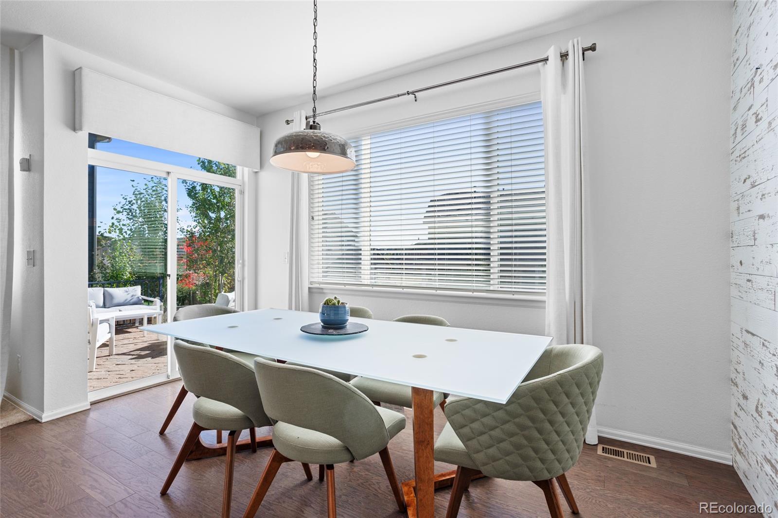1444 Sidewinder Circle Castle Rock, CO 80108 - Photo 8 of 40 a dining room with furniture and window