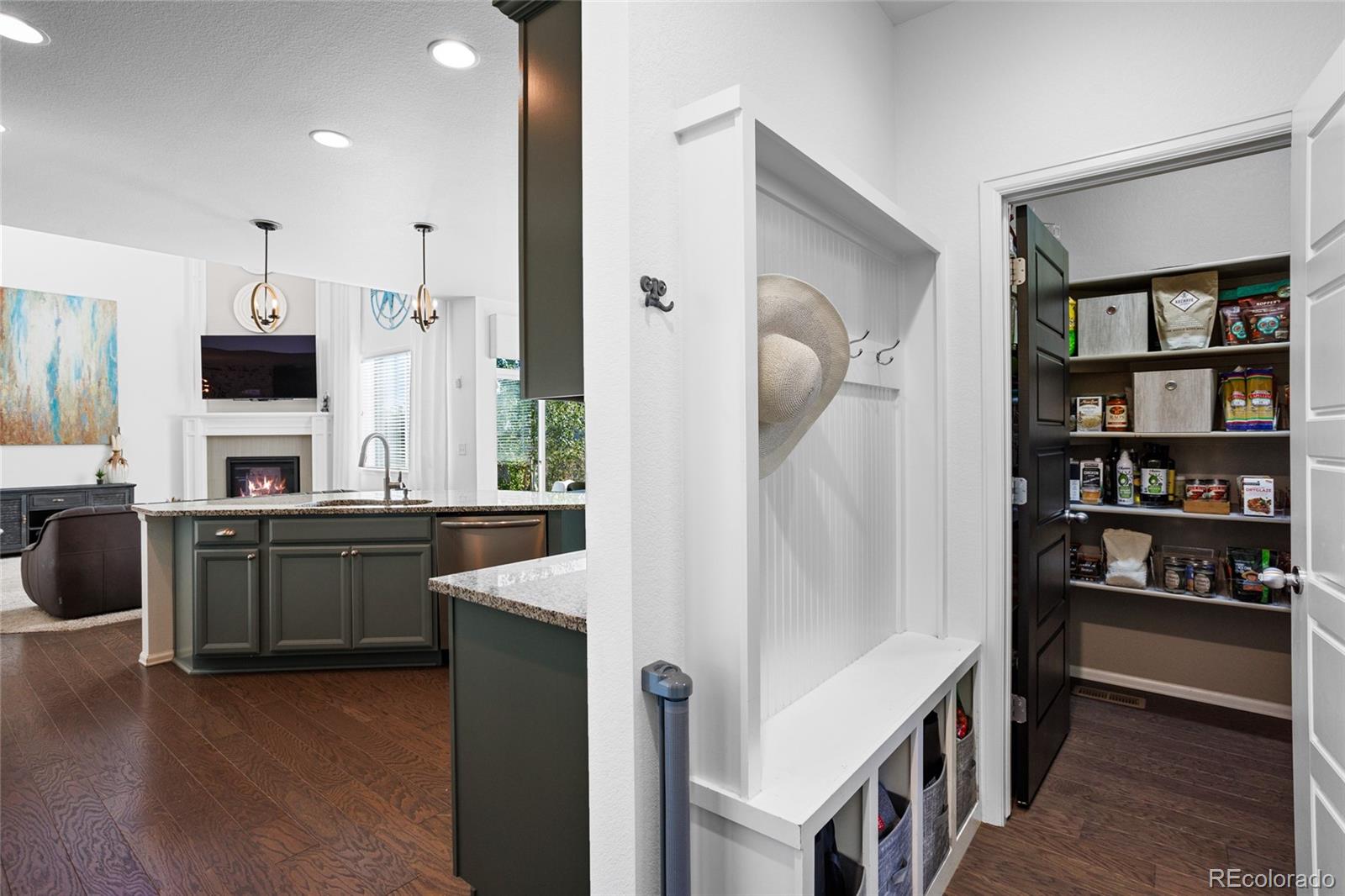 1444 Sidewinder Circle Castle Rock, CO 80108 - Photo 9 of 40 a kitchen with stainless steel appliances granite countertop a refrigerator a stove and a sink