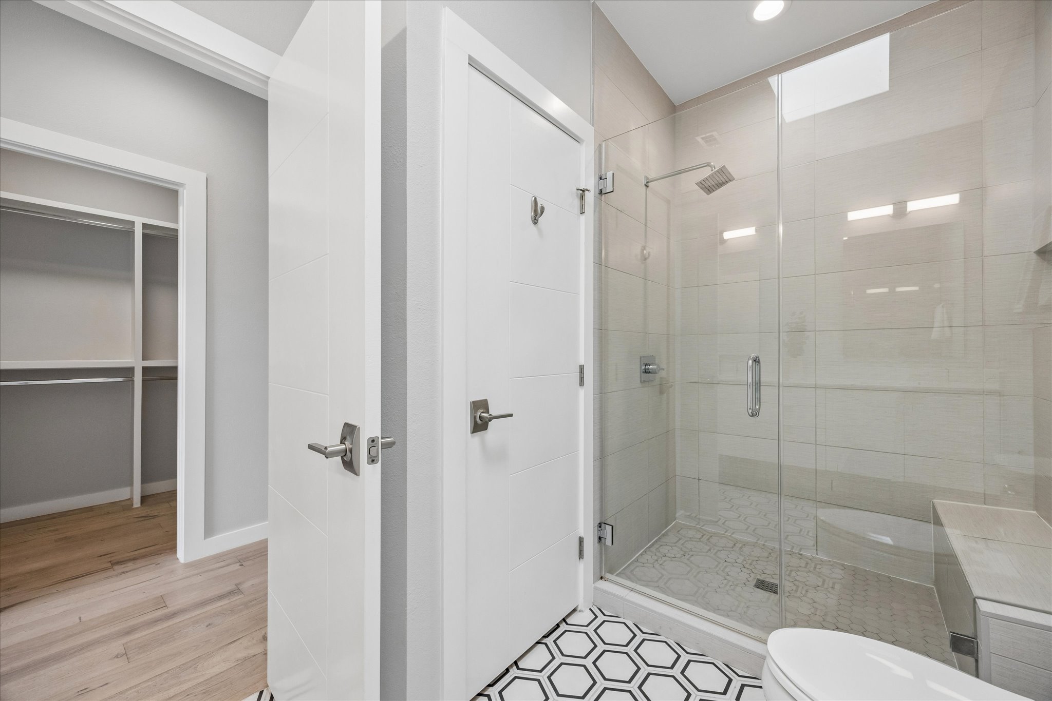 2108 Tillery Street, Unit 9 Austin, TX 78723 - Photo 14 of 25 Primary bathroom with walk-in shower and linen closet