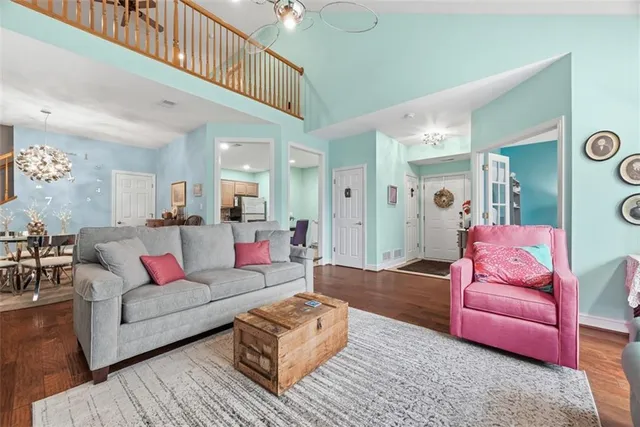 a living room with furniture or couch and a view of kitchen