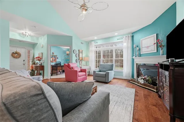 a bedroom with furniture and a flat screen tv