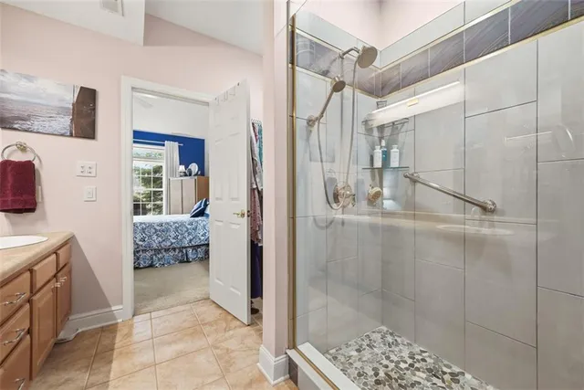 a bathroom with a granite countertop shower