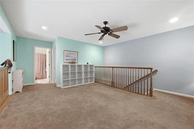 a view of a livingroom with a ceiling fan