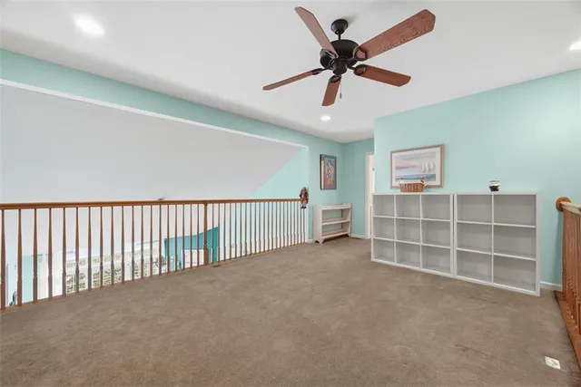 a view of a livingroom with a ceiling fan