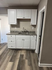 153 Union Street, Unit 1 Lawrence, MA 01841 - Photo 4 of 8 a kitchen with stainless steel appliances granite countertop a stove a sink and a refrigerator