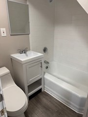 153 Union Street, Unit 1 Lawrence, MA 01841 - Photo 5 of 8 a bathroom with a sink toilet and bathtub