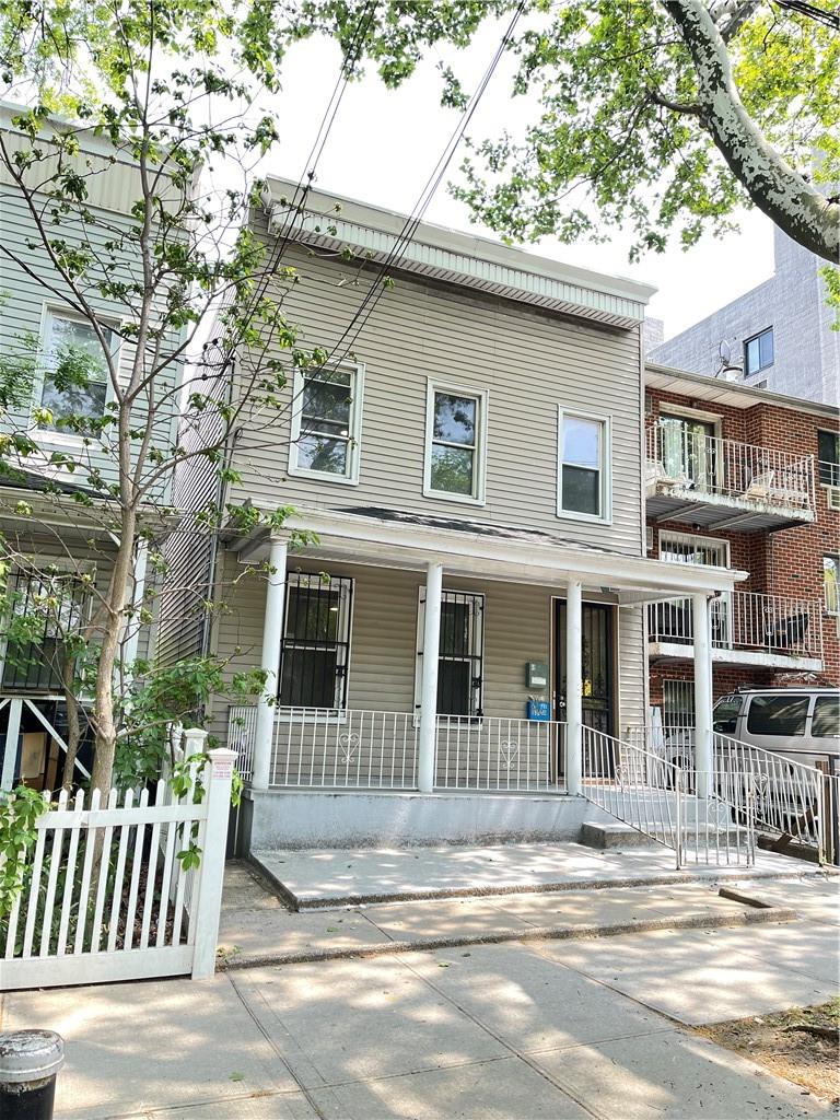 a front view of a house with a porch
