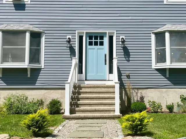 a front view of a house with a yard