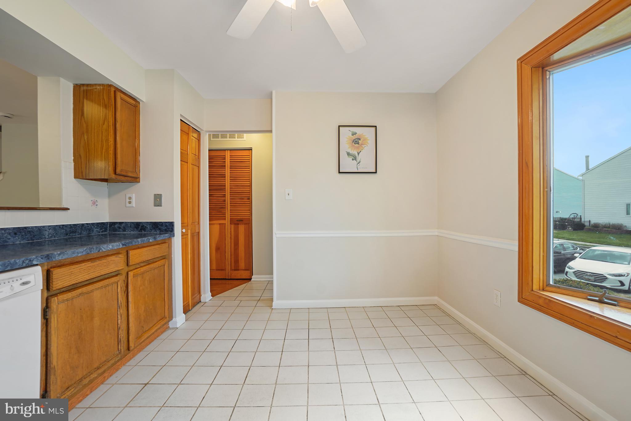 9412 Kilbride Court Perry Hall, MD 21128 - Photo 11 of 52 a spacious bathroom with a granite countertop sink a mirror and a bathtub