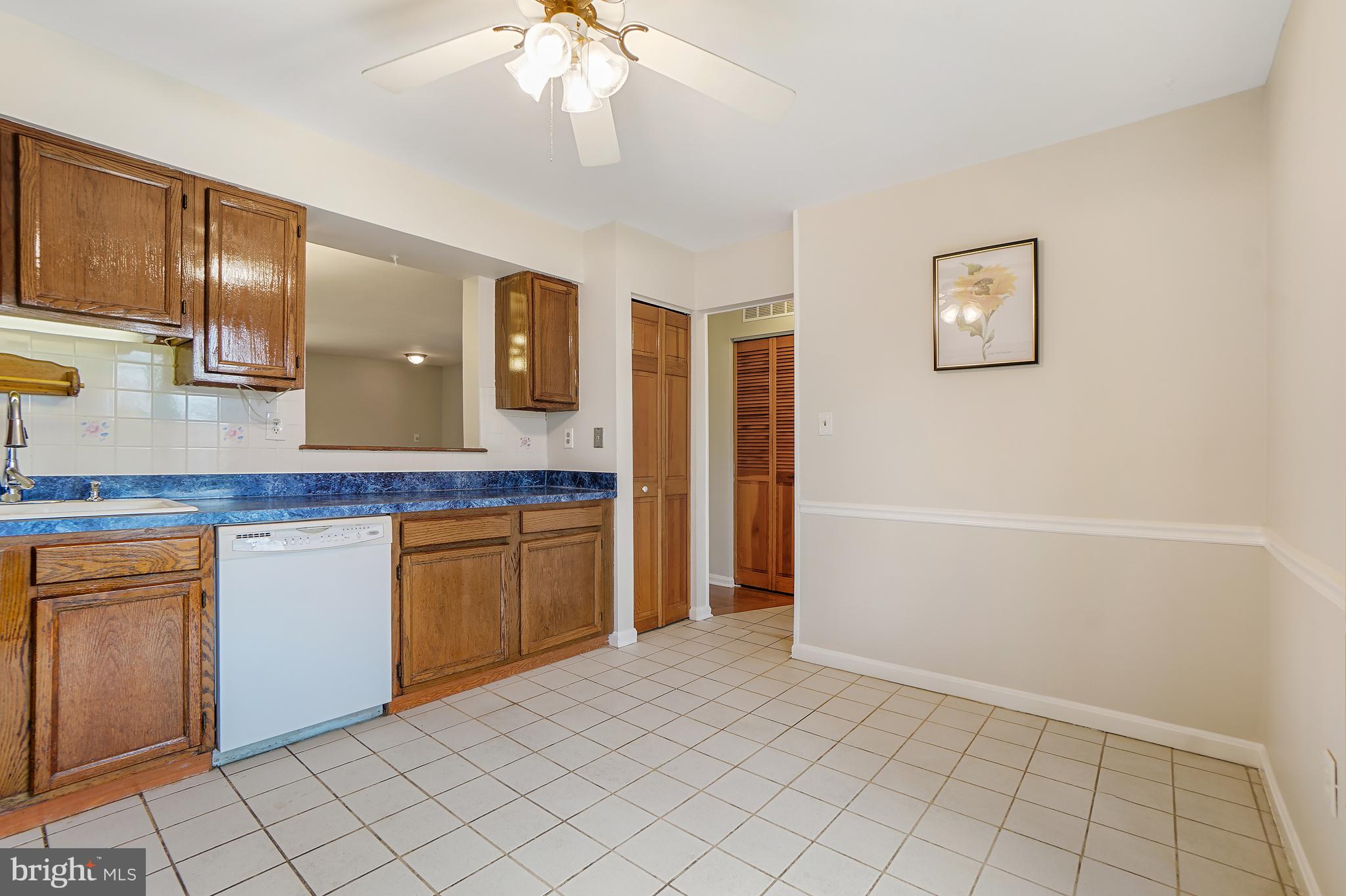 9412 Kilbride Court Perry Hall, MD 21128 - Photo 12 of 52 a spacious bathroom with a granite countertop sink and a mirror
