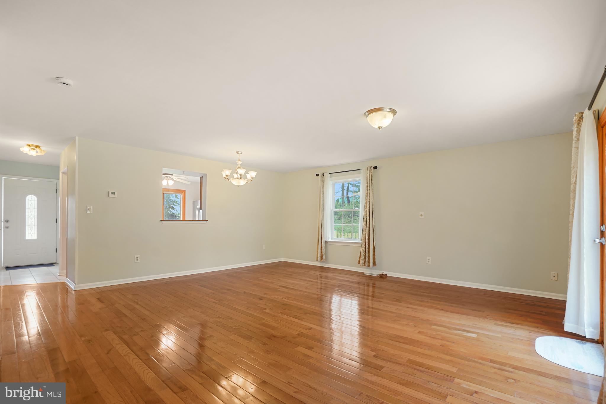 9412 Kilbride Court Perry Hall, MD 21128 - Photo 16 of 52 wooden floor in an empty room with a window