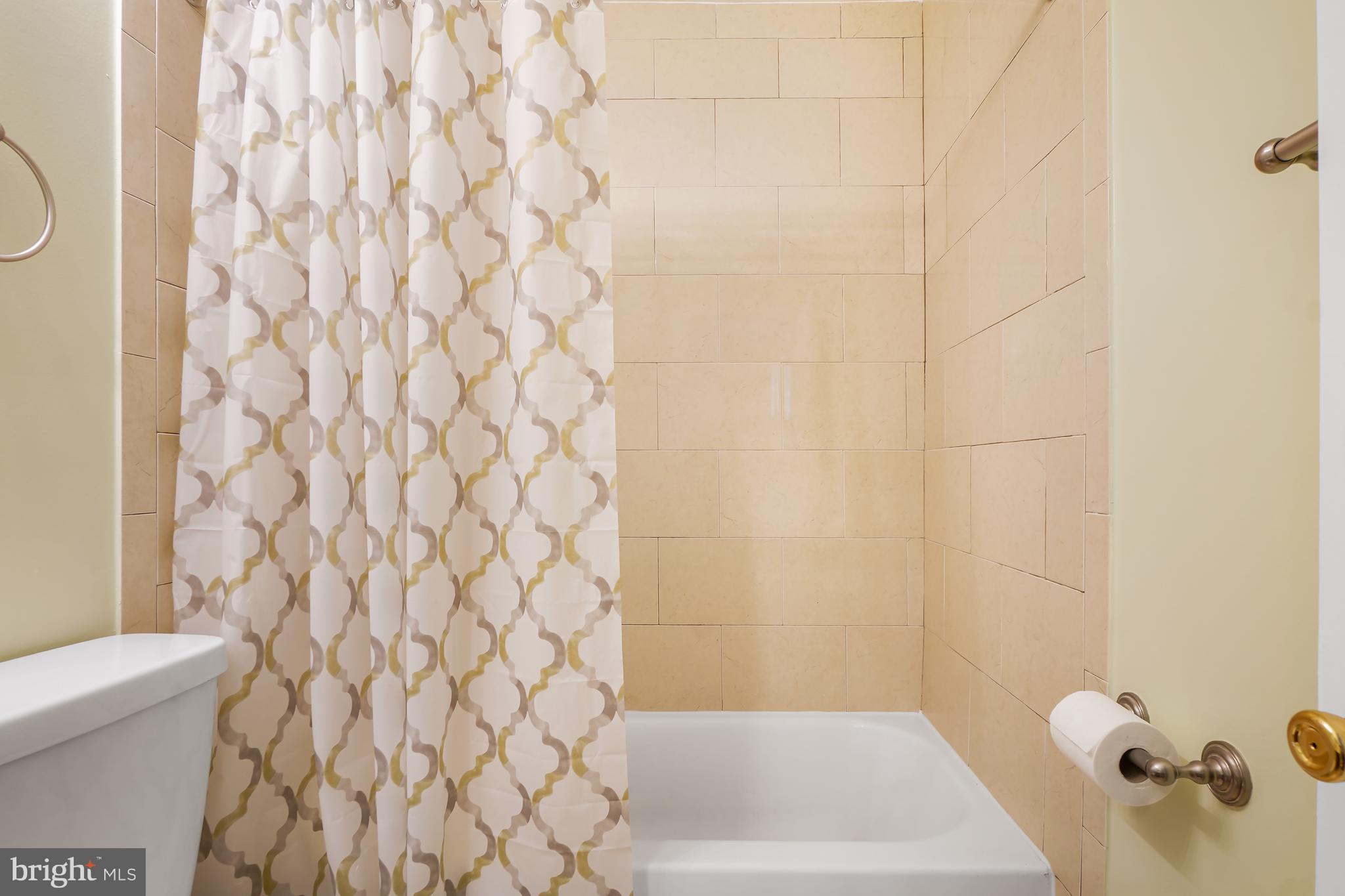 9412 Kilbride Court Perry Hall, MD 21128 - Photo 24 of 52 a bathroom with a bathtub and shower curtain