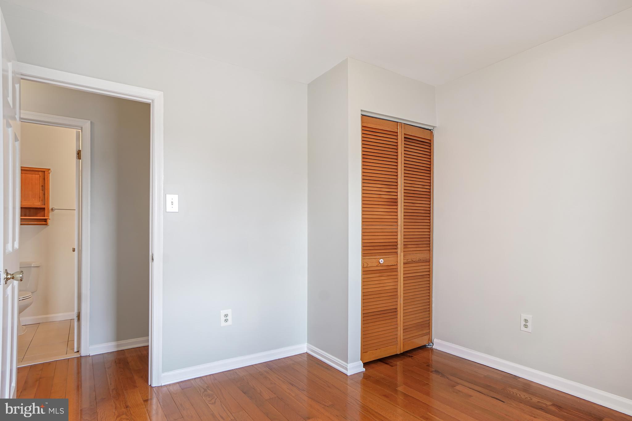 9412 Kilbride Court Perry Hall, MD 21128 - Photo 26 of 52 an empty room with wooden floor and closet