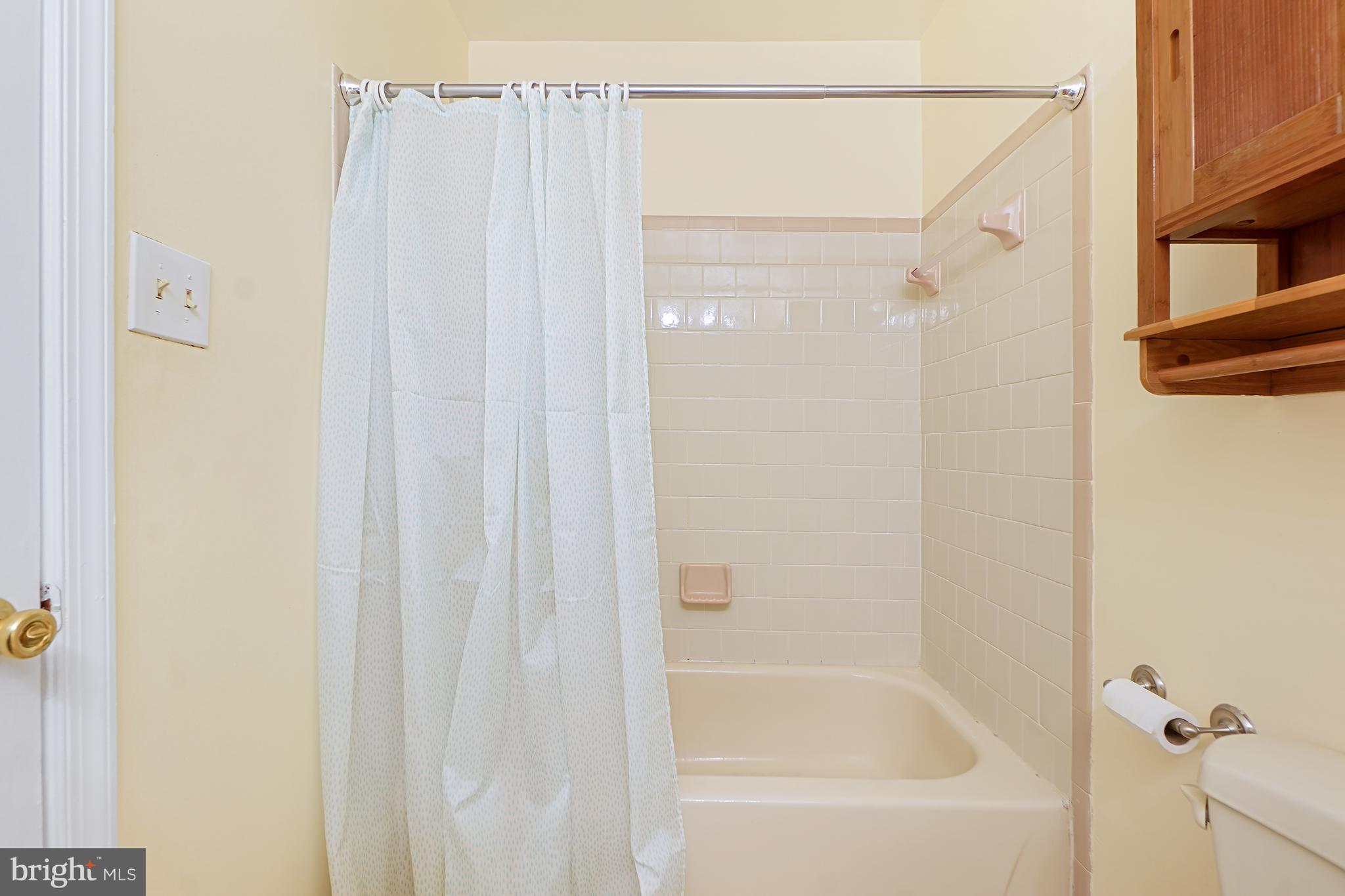 9412 Kilbride Court Perry Hall, MD 21128 - Photo 28 of 52 a bathroom with a shower and a bath tub