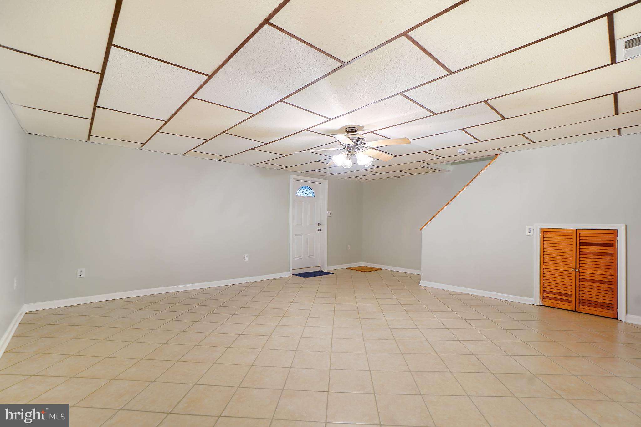 9412 Kilbride Court Perry Hall, MD 21128 - Photo 32 of 52 a view of an empty room with a ceiling fan
