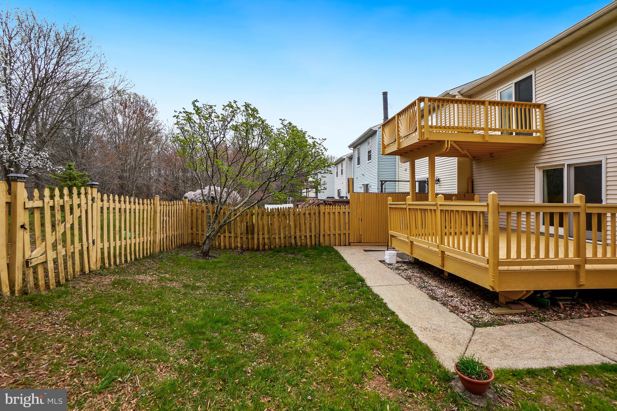9412 Kilbride Court Perry Hall, MD 21128 - Photo 42 of 52 a view of a house with a yard and deck area with wooden fence