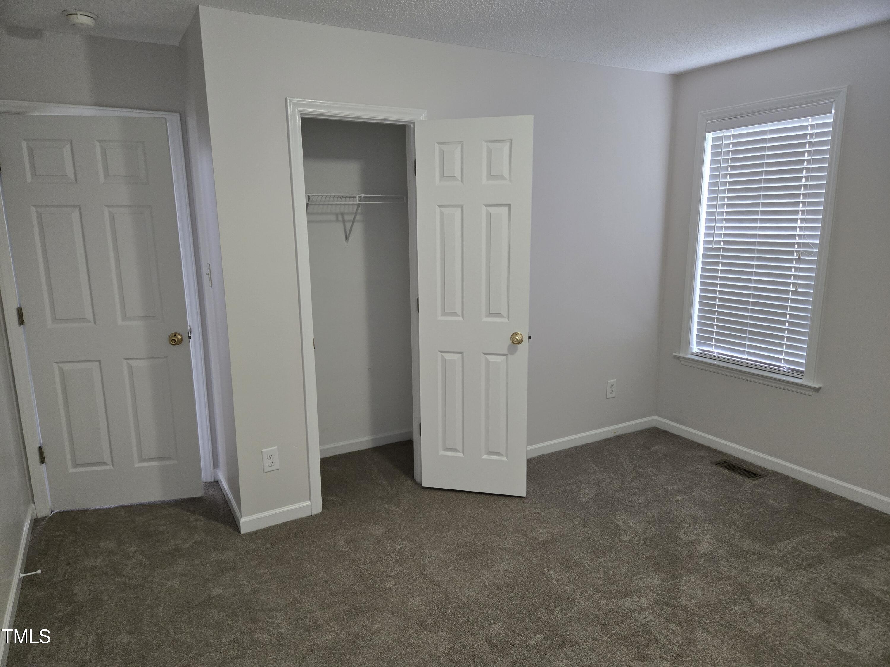 288 Rosa Circle Willow Spring, NC 27592 - Photo 15 of 19 an empty room with windows