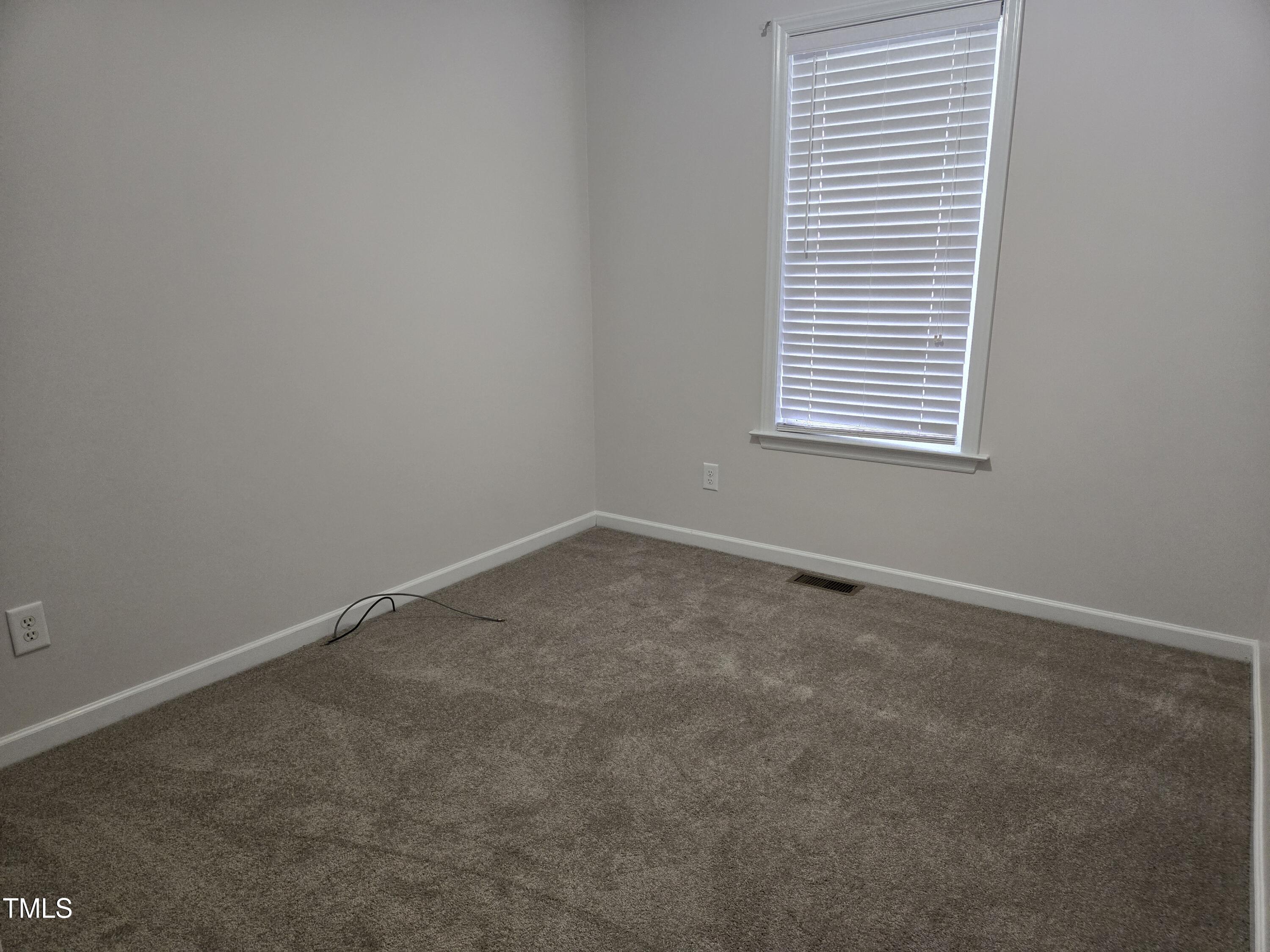 288 Rosa Circle Willow Spring, NC 27592 - Photo 17 of 19 an empty room with a window