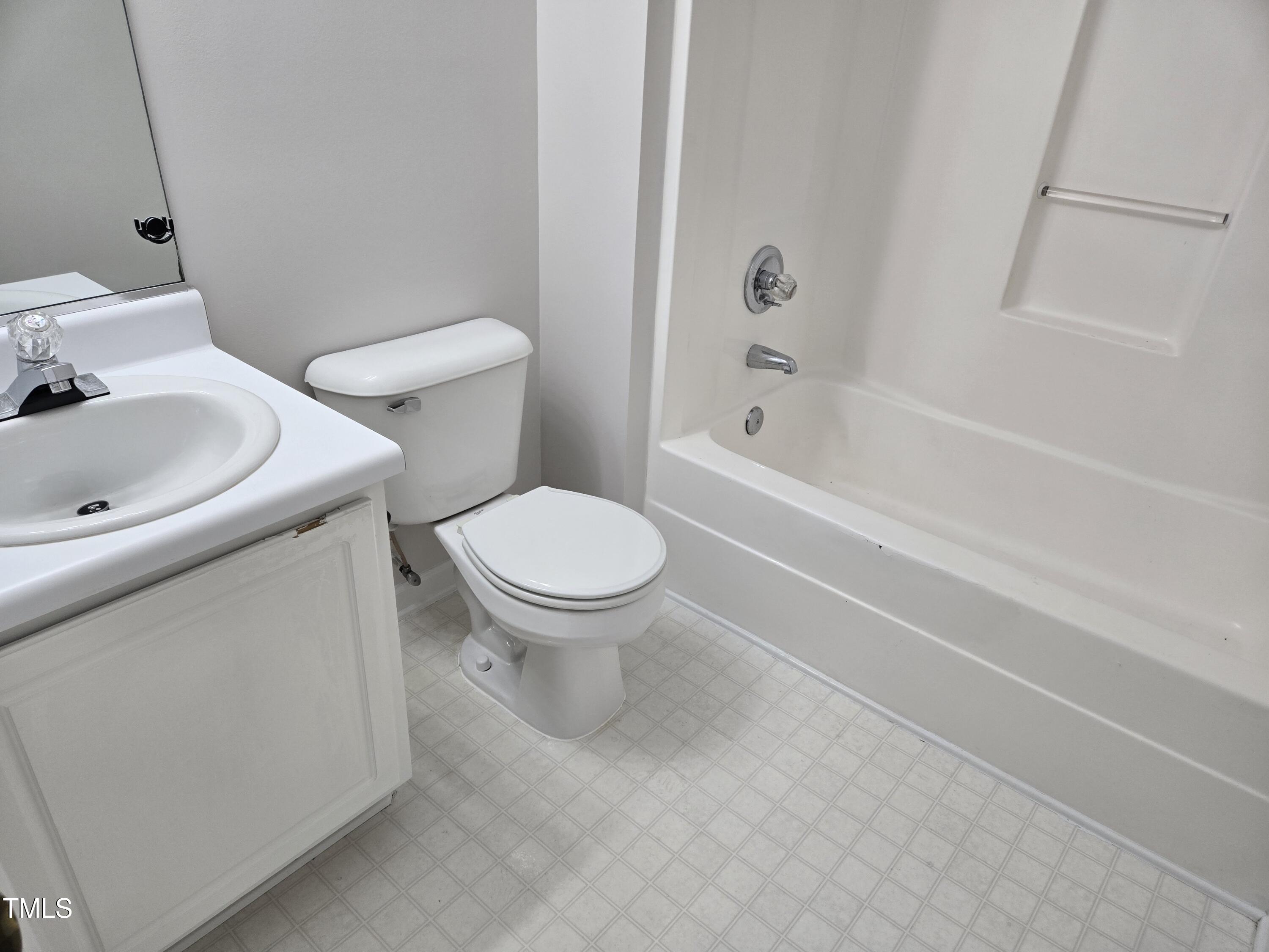 288 Rosa Circle Willow Spring, NC 27592 - Photo 19 of 19 a white toilet sitting next to a bath tub