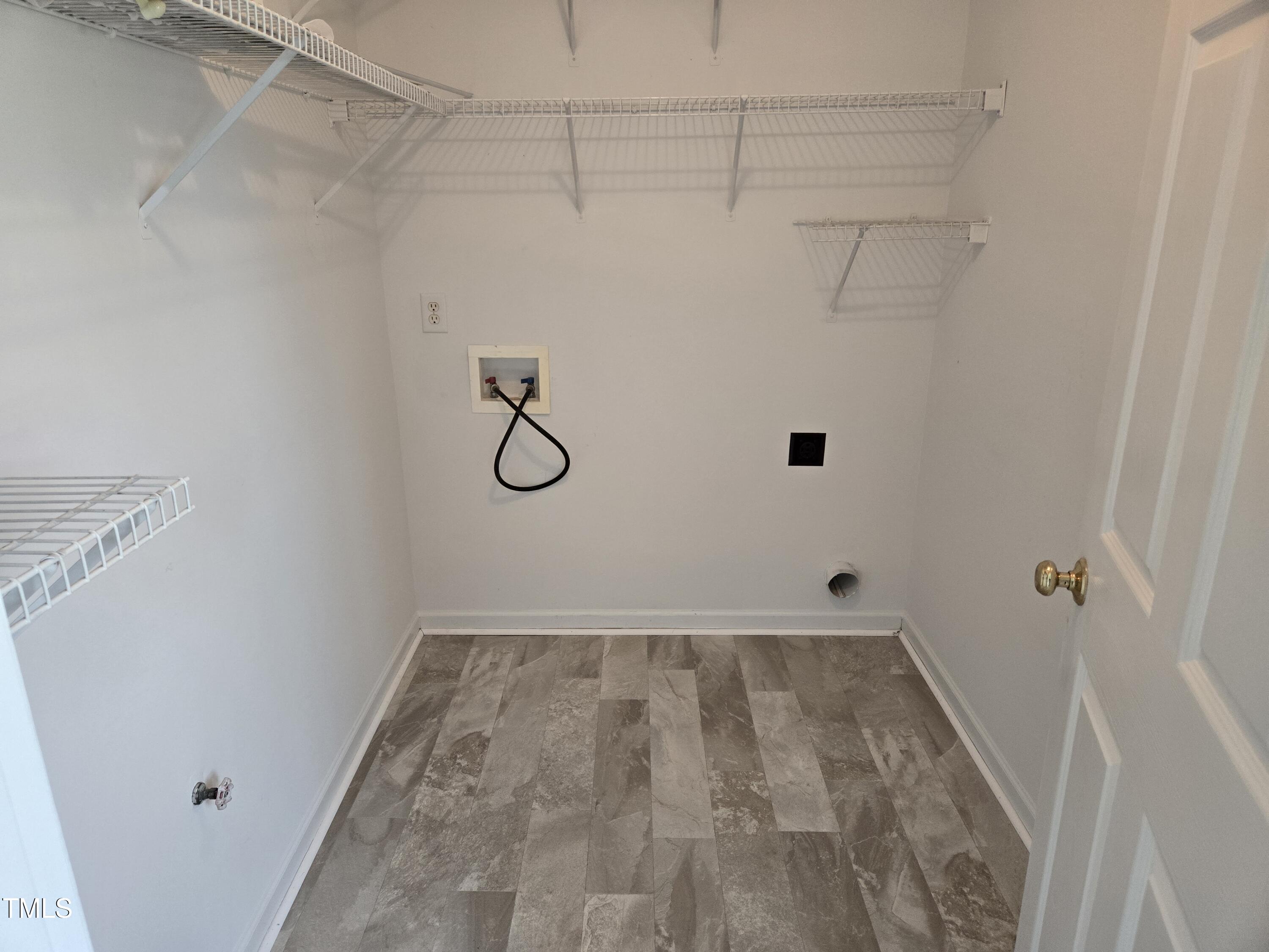288 Rosa Circle Willow Spring, NC 27592 - Photo 5 of 19 a view of a room with racks on the wall