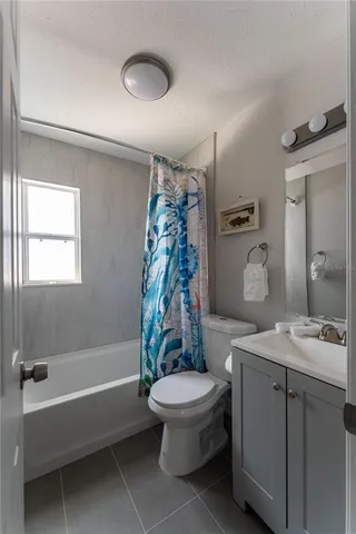 a bathroom with a sink a toilet and a bathtub