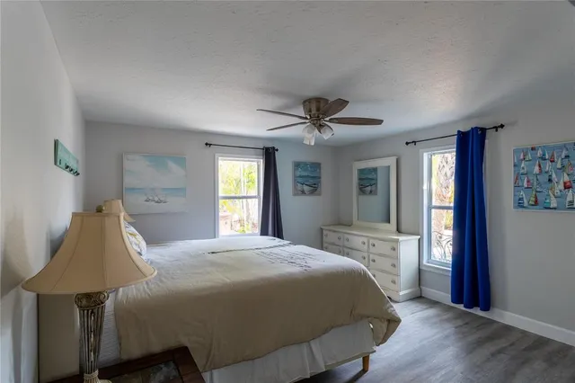 a bedroom with a bed and a lamp on table