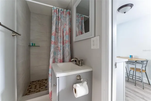 a bathroom with a sink and a mirror