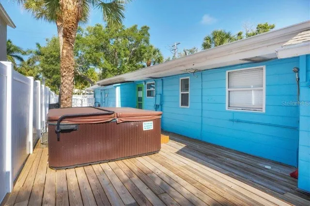 a view of a backyard with sitting area