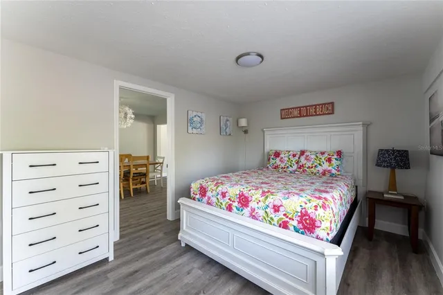 a bedroom with a bed and a closet