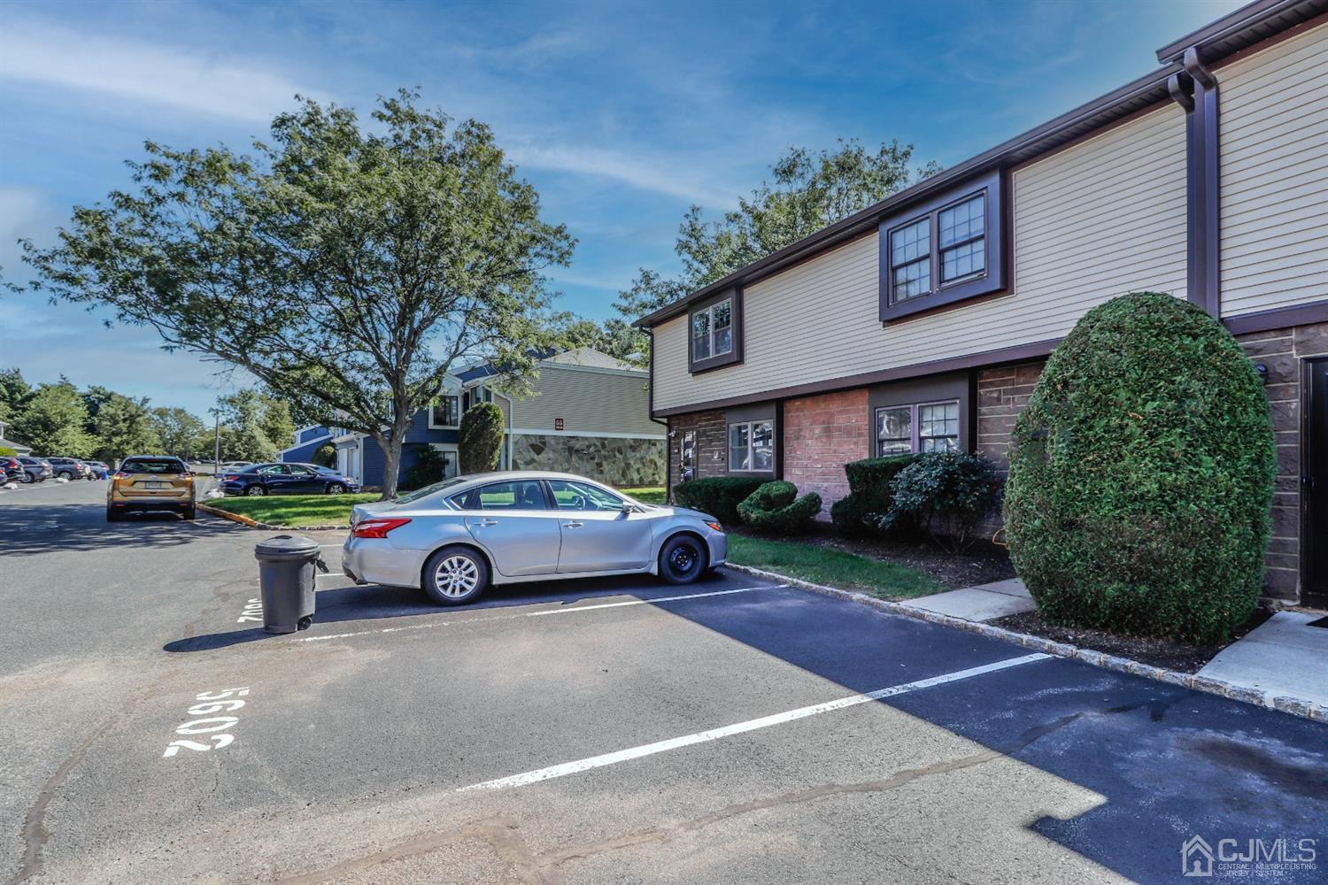 5602 Hana Road Edison, NJ 08817 - Photo 2 of 29 a front view of a house with a garden and parking