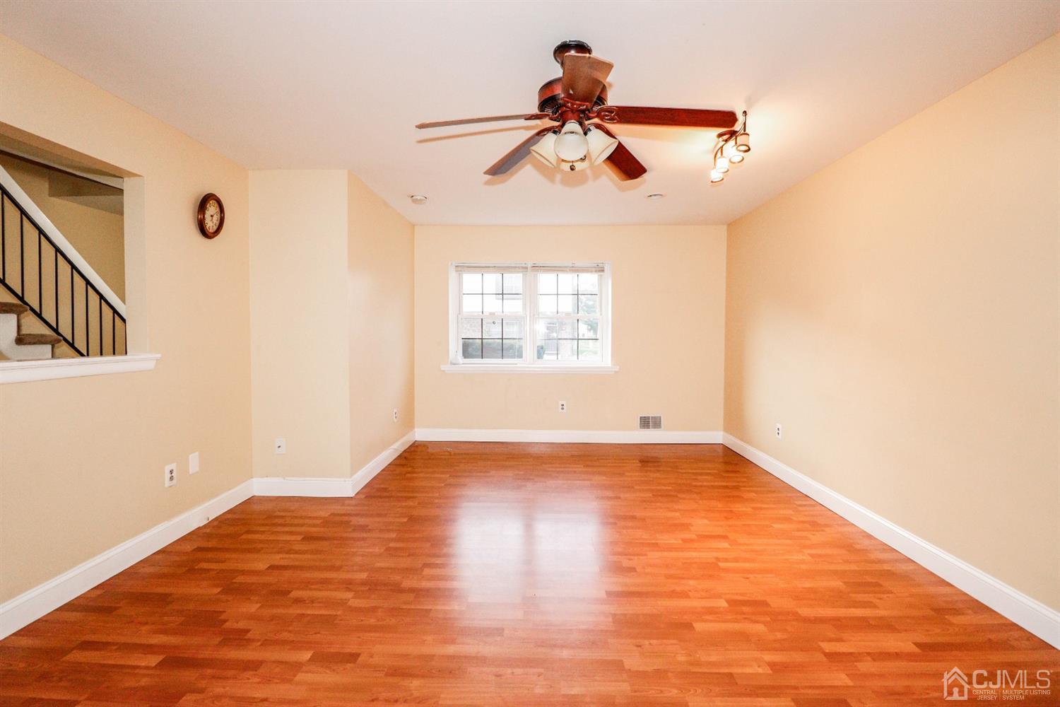 5602 Hana Road Edison, NJ 08817 - Photo 15 of 29 a view of empty room with wooden floor and fan