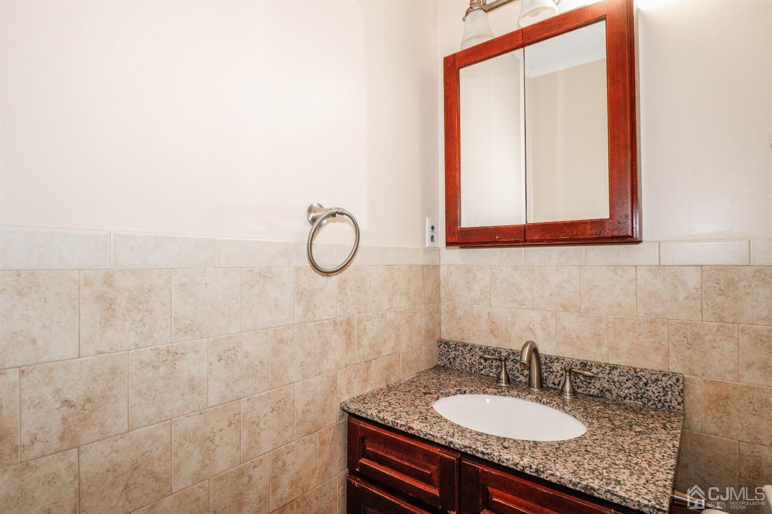 5602 Hana Road Edison, NJ 08817 - Photo 18 of 29 a bathroom with a sink and a mirror