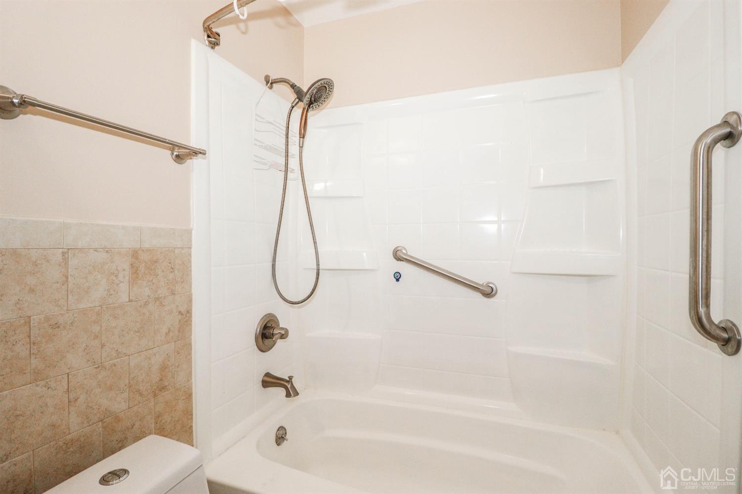 5602 Hana Road Edison, NJ 08817 - Photo 19 of 29 a bathroom with a bath tub with a shower