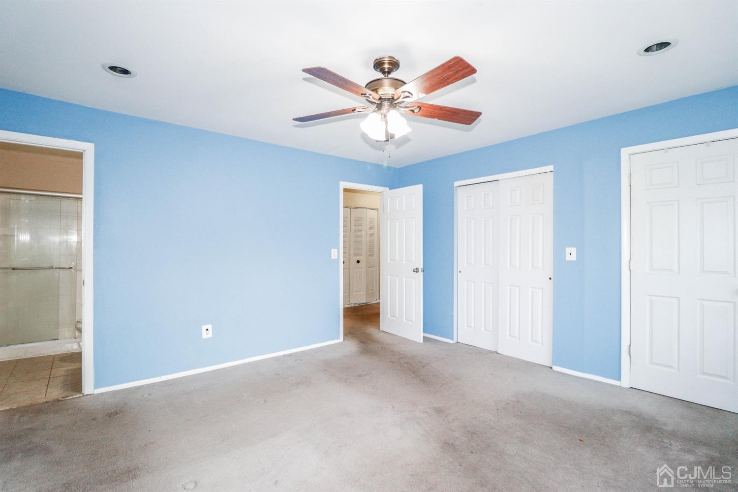 5602 Hana Road Edison, NJ 08817 - Photo 23 of 29 a view of an empty room with a fan