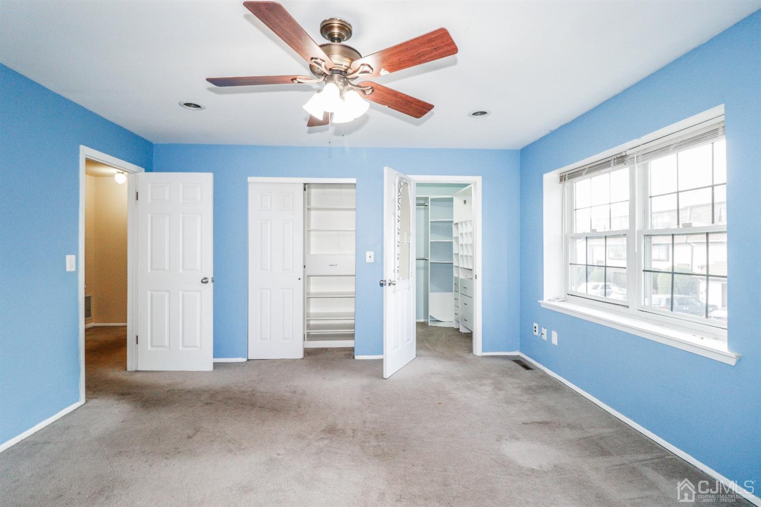 5602 Hana Road Edison, NJ 08817 - Photo 24 of 29 an empty room with windows and fan