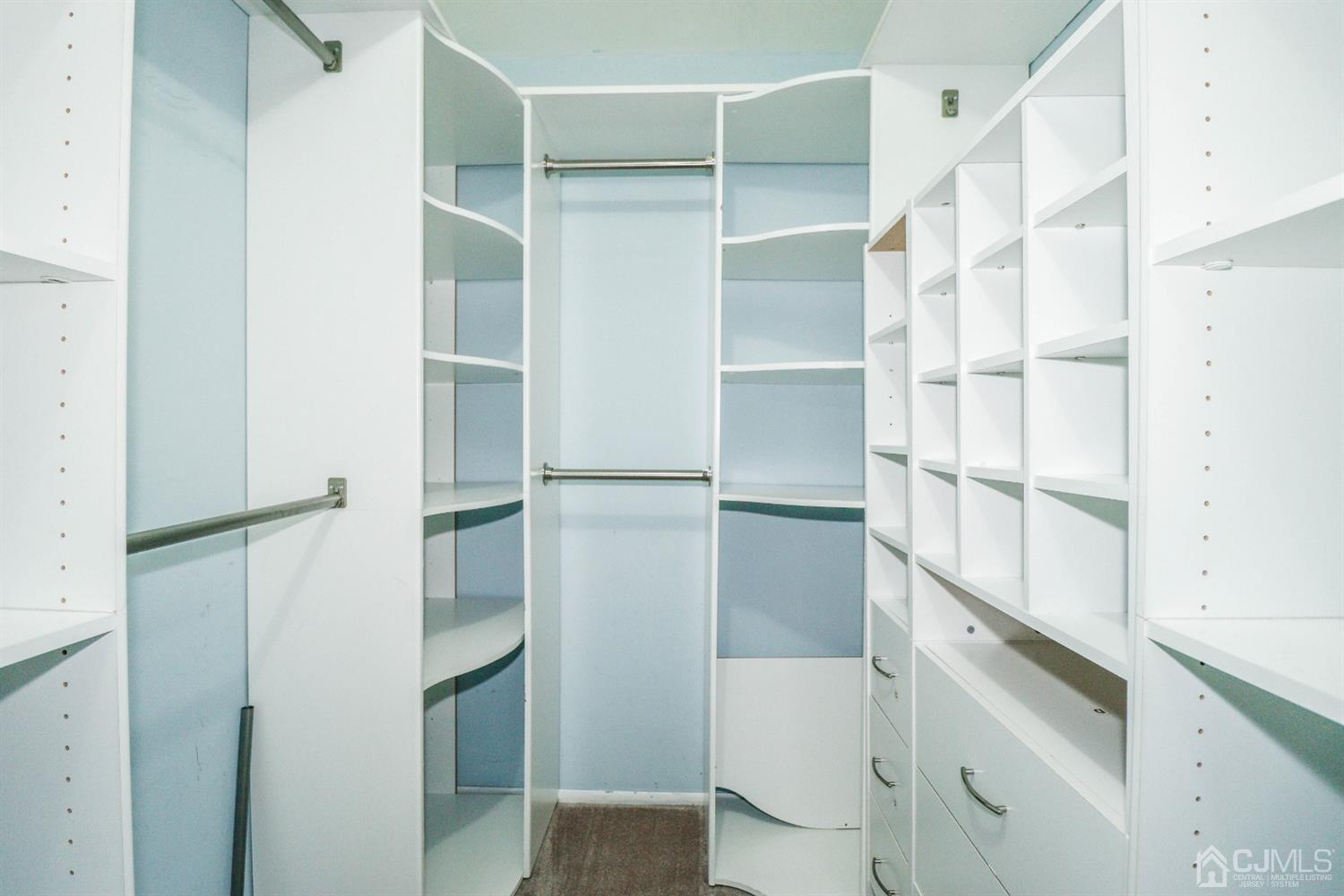 5602 Hana Road Edison, NJ 08817 - Photo 25 of 29 a view of walk in closet with empty racks