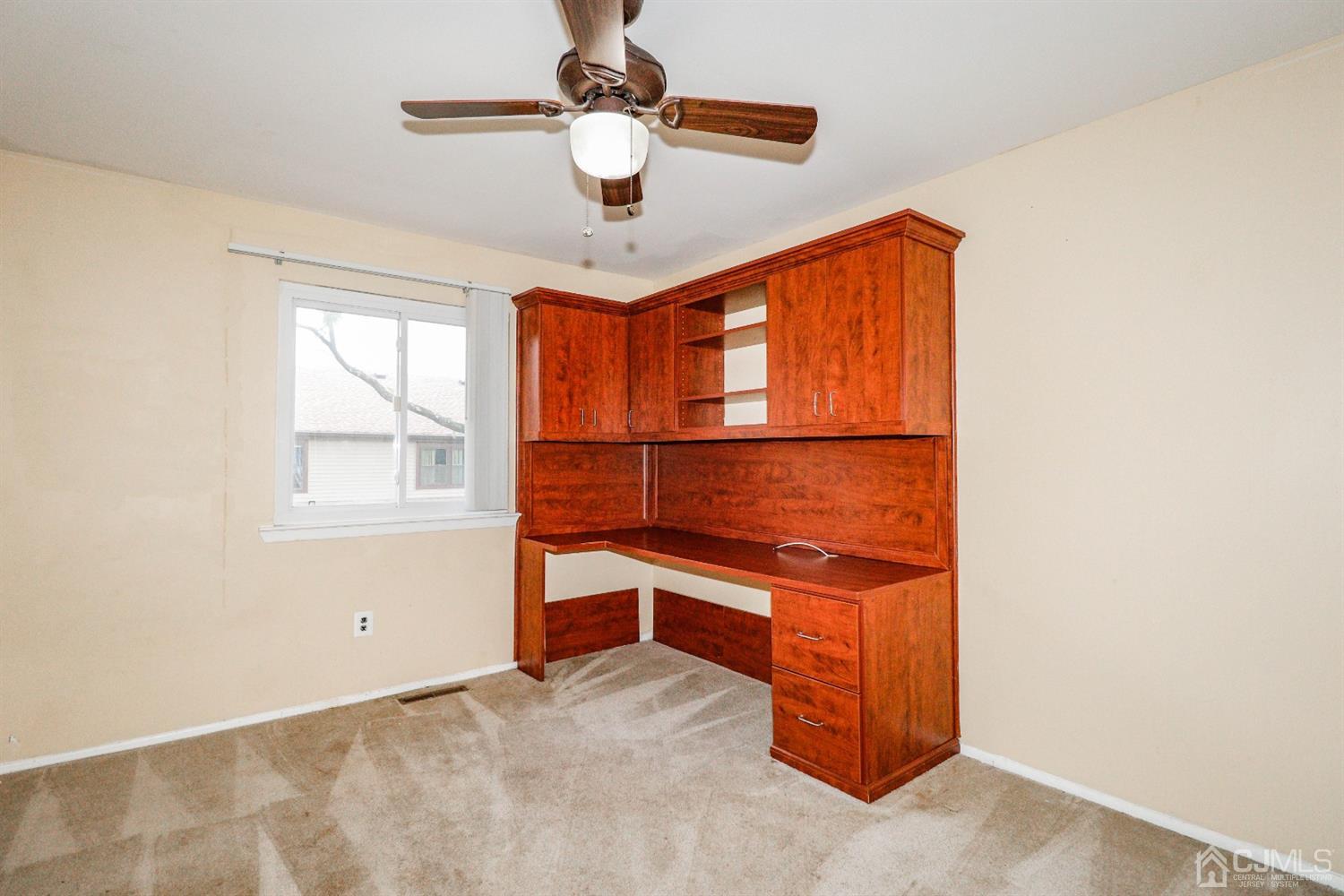 5602 Hana Road Edison, NJ 08817 - Photo 26 of 29 a view of room with a ceiling fan