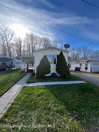 a view of a back yard of the house