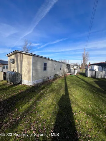 a view of a back yard of the house